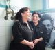 Sisters Rose Banks and Yvette Kelly, who took over the Gatwick from their mother, with their portrait in a bathroom.