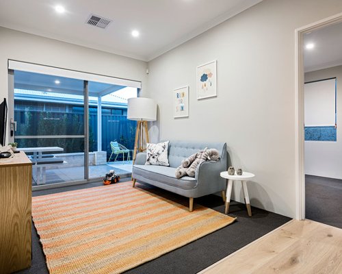 Inspiration for a scandinavian gender-neutral toddler room in Perth with grey walls and carpet. — Houzz