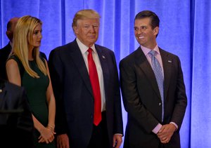 President-elect Donald Trump waits with family members Ivanka Trump, left, and Donald Trump Jr. before speaking at a news conference, Wednesday, Jan. 11, 2017, in New York.