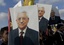 Protesters carry pictures of Palestinian President Mahmoud Abbas, during a protest supporting the hunger striking Palestinian prisoners in Israeli jails, in the West Bank city of Ramallah, Wednesday, May 3, 2017.