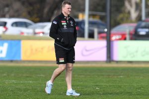 Nathan Buckley takes some time out at Collingwood training on Monday.