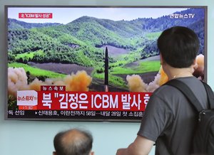 People watch a local TV news showing what was said to be the launch of a Hwasong-14 intercontinental ballistic missile, ICBM, aired by North Korea's KRT, at Seoul Train Station in Seoul, South Korea, Tuesday, July 4, 2017.