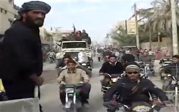 Syrian rebels celebrating the takeover of Mayadeen military base near Deir el-Zour