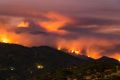 Fire burns in the mountains west of Santa Barbara, California on Sunday.