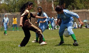 School Girls inaction during a Final of women Football championship organised by Jammu and Kashmir Football Association at Government college for women  in Srinagar on Friday 11 July 2014.