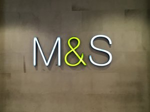 M&S Marks and Spencer's famous initials on their shop's wall inside a mall. Taken on June 2017.