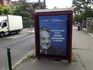 This photo taken Wednesday, July 5, 2017 in Budapest, Hungary, shows an anti-Soros campaign reading "99 percent reject illegal migration" and “Let’s not allow Soros to have the last laugh”.