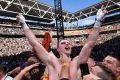 Top of the world: Jeff Horn points to the sky in celebration after being announced the winner.