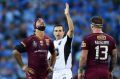 Referee rarity: Bernard Sutton and Johnathan Thurston during Origin II.