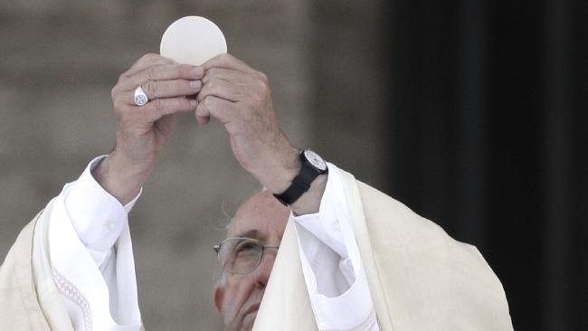 Pope Francis rises the holy host during a Mass prior to the Corpus Domini procession from St. John at the Lateran Basilica to St. Mary Major Basilica to mark the feast of the Body and Blood of Christ, in Rome, Sunday, June 18, 2017. The event is dedicated to the mystery of the Eucharist and concludes the cycle of feasts following Easter. (AP Photo/Andrew Medichini)