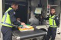 First Class Constable Katie Roberts scans parcels through the new x-ray truck. 