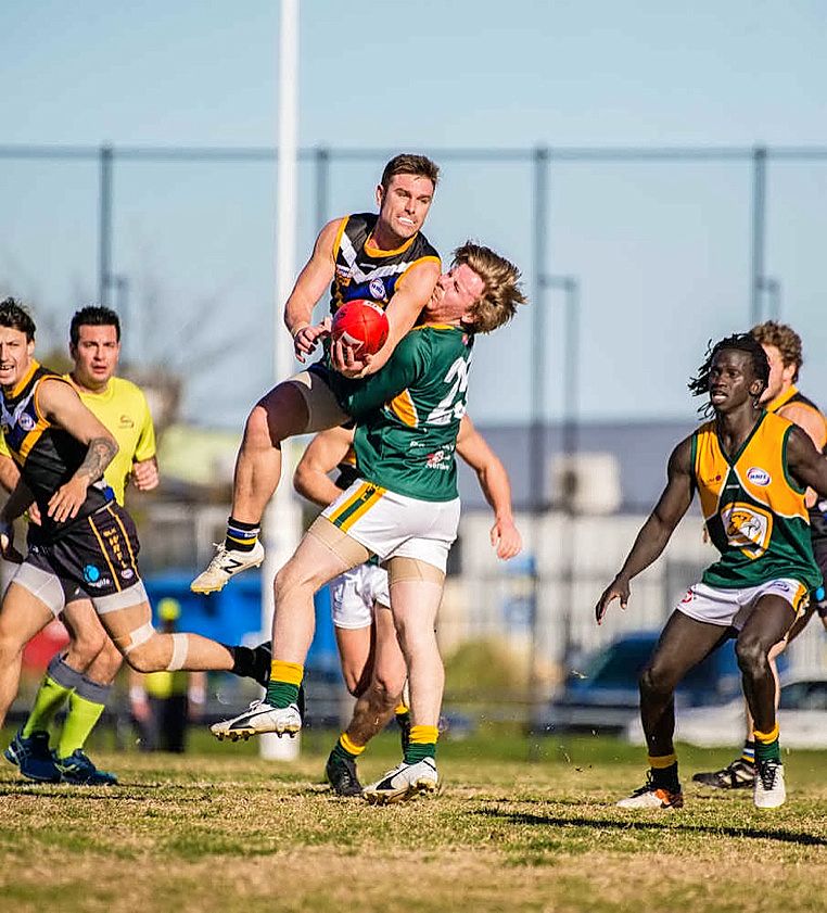 1/7/17 North West Photography. WRFL CAROLINE SPRINGS VS WYNDHAMVALECaroline Springs No 4 James Ryan and tackled by Wyndhamvale 25 Todd KreihnPicture Marco De Luca