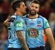 Game over: New South Wales players console each other following game three of State of Origin.