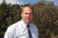 Manager of the Federal Golf Course at Red Hill Scott Elias, pictured in 2015 in front of the site the golf club hopes to ...