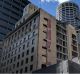 Two giant Shell signs painted on the side of Shell House at 2-12 Carrington Street, Sydney have been uncovered by the ...