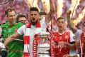 On fire: Arsenal players celebrate their FA Cup victory over Chelsea in May.