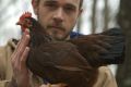 Brian Caraker believes in singing to his chickens.
