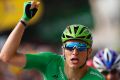 Germany's Marcel Kittel, wearing the best sprinter's green jersey, crosses the finish line to win the eleventh stage.