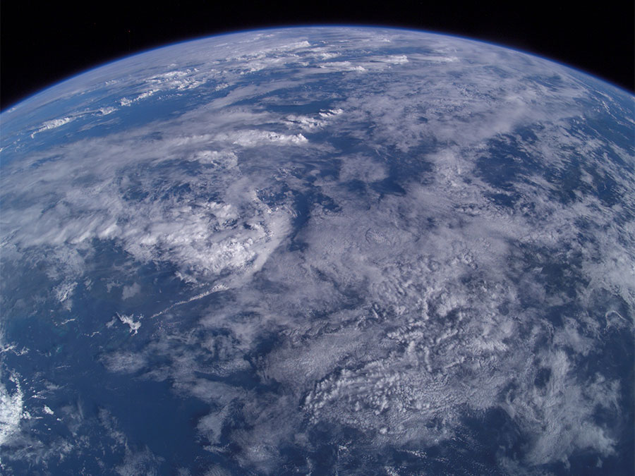 Aerial photo from 380 km over earth from the International Space Station over Mindanao Island group, Philippines. Atmosphere, clouds weather sky, limb of the earth