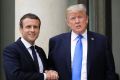 French President Emmanuel Macron, left, welcomes US President Donald Trump.