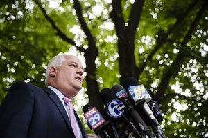 Matthew Weintraub, District Attorney for Bucks County, Pa., second right, speaks with members of the media, Wednesday, July 12, 2017, in Solebury, Pa., as the search continues for four missing young Pennsylvania men feared to be the victims of foul play.