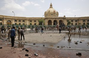 Indian police gather outside the Legislative Assembly after they baton-charge students of Bachelor of Physical Education during a protest against Uttar Pradesh state government in Lucknow, India, Tuesday, Sept. 1, 2015.