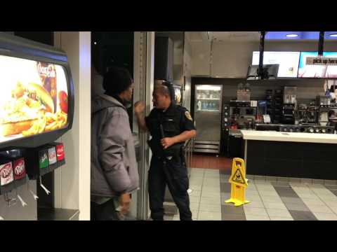 Security guard fights for his life at Mcdonalds. Santa Monica CA. USA.