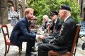 Prince Harry meets Dunkirk veterans Arthur Taylor and Garth Wright at a reception hosted by the Prince at Kensington ...