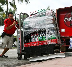 An employee delivers cases of Coca-Cola in Miami Beach, Florida.