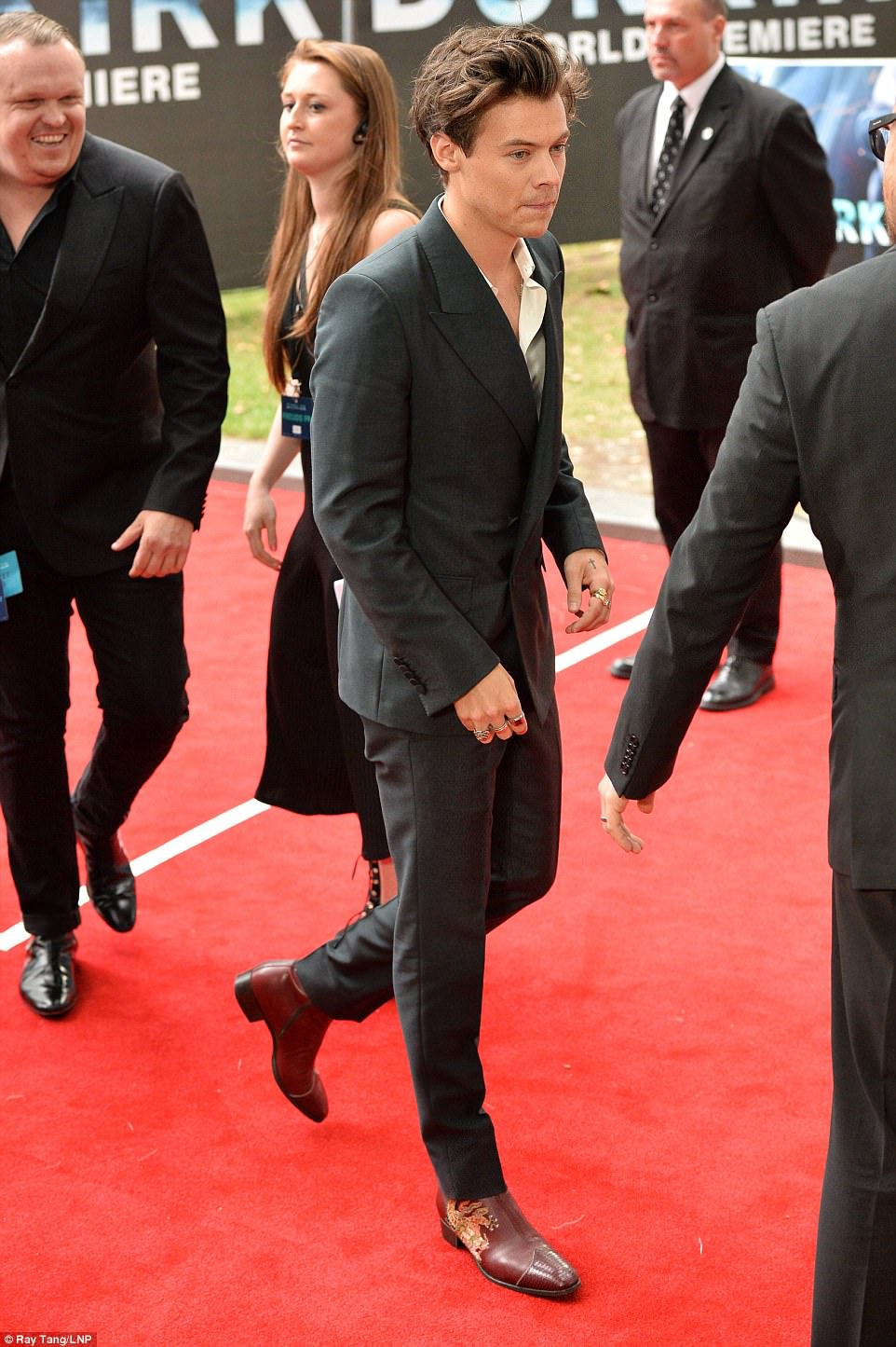 Star arrival: Harry, who has won early praise for his role of Alex in Dunkirk, was dressed to impress in his paired down, minimalistic black suit