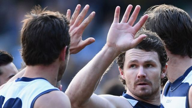 Patrick Dangerfield is congratulated by teammates after kicking a goal  against Hawthorn at the MCG on Saturday