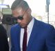 Convicted: Tim Simona arrives at Campbelltown Local Court before being found guilty of a fraud charge and handed a ...