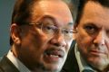 Then Malaysian opposition leader Anwar Ibrahim, left, with Australian senator Nick Xenophon in Jakarta.