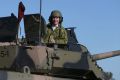 Defence Industry Minister Christopher Pyne, in the turret of Patria AMV35 at Puckapunyal Range, Victoria.