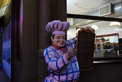 Spooky chef. Night photographs on the streets of New York, NYC, December 2006