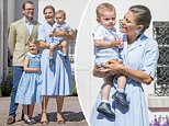 Stealing the limelight: Her playful three-year-old niece has already stolen the show once. And for Crown Princess Victoria of Sweden (pictured with her fist in the air), who celebrated her 40th birthday yesterday, the limelight was whipped away from her again today - this time by her son, Prince Oscar (in her arms next to Princess Estelle, centre, and Prince Daniel, far left)