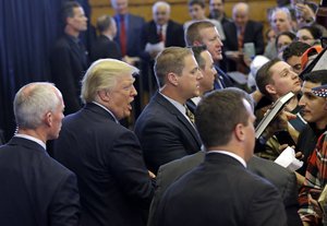 Republican presidential candidate Donald Trump is surrounded by security as he greets supporters after his speech at a campaign rally, Friday, April 15, 2016, in Plattsburgh, N.Y.