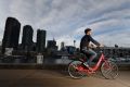 Andrew Taylor takes a Reddy Go hire bike for a test ride in Pyrmont, Sydney.