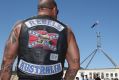 A patched Rebels member who was among riders protesting bikie laws at Parliament House in Canberra in December 2014. 