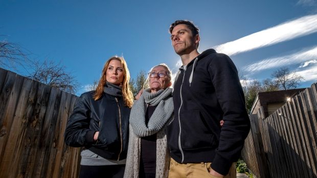 Rien Low with his sister Brooke and mother Jenny, who is in an uphill battle with Suncorp Bank.