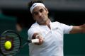 Roger Federer returns to Bulgaria's Grigor Dimitrov during their day seven match.