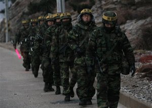 South Korean marines patrol on Yeonpyeong island, South Korea, Sunday, Dec. 19, 2010. Military maneuvers planned by South Korean troops did not take place Saturday because of bad weather on the border island shelled by North Korea last month, but the U.N. Security Council scheduled an emergency meeting at Russia's request amid concerns over rising tensions on the divided peninsula.