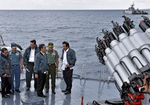 FILE - In this June 23, 2016 file photo released by the Indonesian Presidential Office, Indonesian President Joko Widodo, third right, accompanied by, from left to right, Cabinet Secretary Pramono Anung, Navy Chief of Staff, Adm. Ade Supandi, top Security Minister Luhut Panjaitan, Armed Forces Chief Gen. Gatot Nurmantyo and Riau Islands Gov. Nurdin Basirun stands on the deck of navy warship KRI Imam Bonjol, on the waters of Natuna Islands, Indonesia. Indonesia doesn’t have a territorial dispute with China