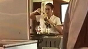 This footage of a flight attendant caught pouring champagne back into a bottle is not what it seems.