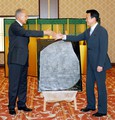 Egyptian Foreign Minister Ahmed Aboul Gheit, left, shakes hands with his Japanese counterpart Taro Aso after Aboul Gheit presented Aso a gift of a replica of the Rosetta Stone at the Foreign Ministry's Iikura guest house in Tokyo Monday, May 15, 2006