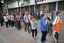 Supporters of Venezuela's President Nicolas Maduro lineup to cast their ballots during a test in preparation for the election of members of a constitutional assembly, in Caracas, Venezuela, Sunday, July 16, 2017.