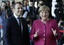 New French President Emmanuel Macron is welcomed by German Chancellor Angela Merkel in Berlin Monday, May 15, 2017, during his first foreign trip after his inauguration the day before.