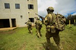 KAHUKU TRAINING AREA, Hawaii (July 13, 2016) - An Australian Army fireteam, attached to Golf Company, 2nd Battalion, 3rd Marines, rushes toward their objective as part of a raid during Rim of the Pacific 2016.