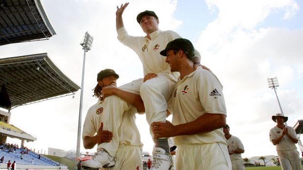 Stuart MacGill is chaired from the ground by Andrew Symonds and Mitchell Johnson after his final Test, in 2008 in the ...