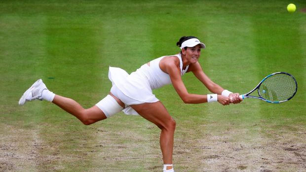 Garbine Muguruza plays a backhand in a winning shot against Venus Williams.